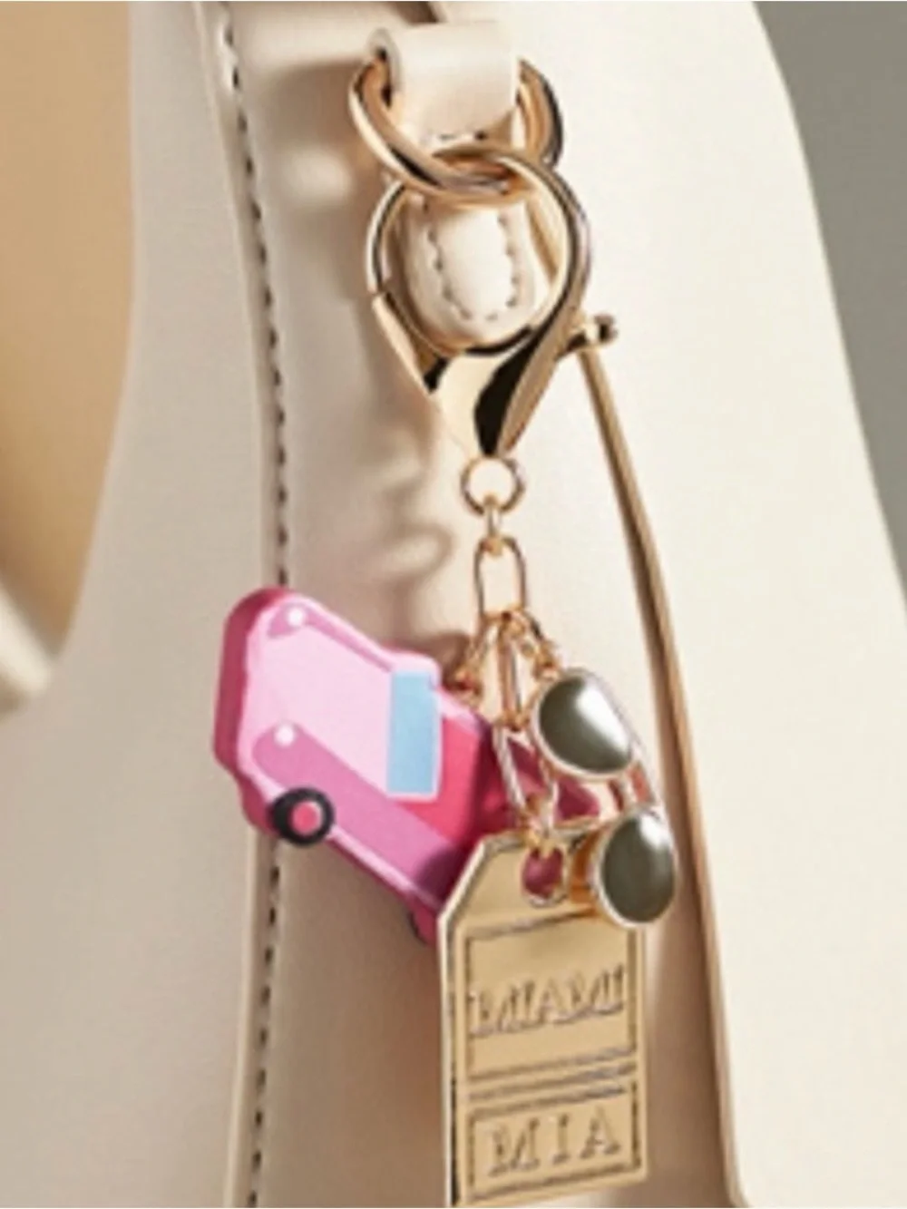 Anthropologie Miami city bag charm pink enamel car gold tag key charm NWT